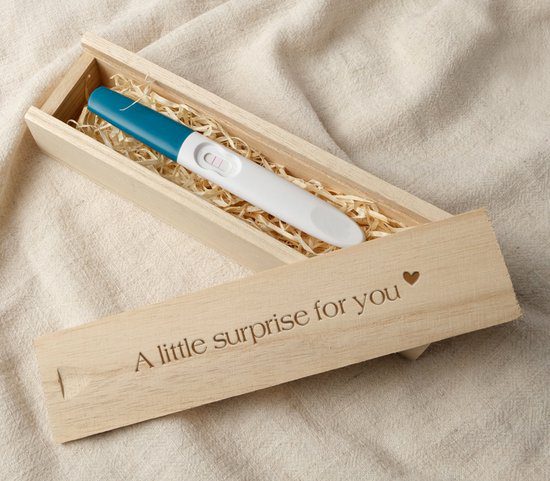 Doosje met een positieve zwangerschapstest